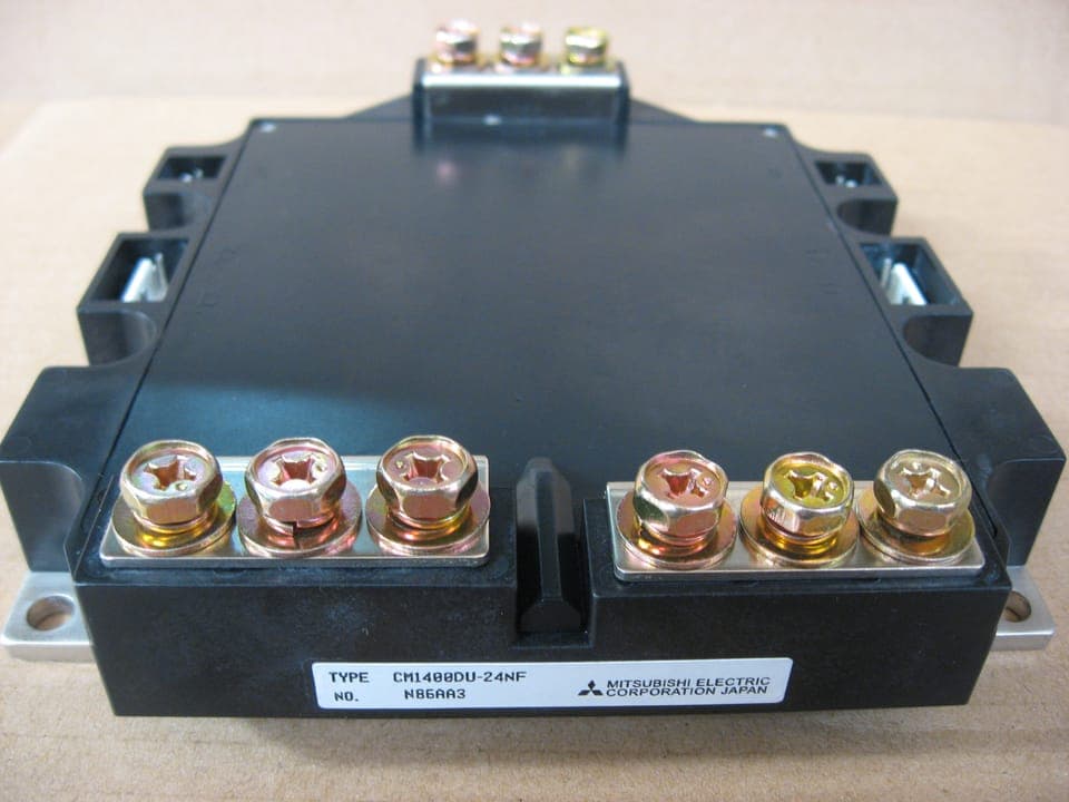An IGBT power module: heavy screw power terminals and thin gate pins